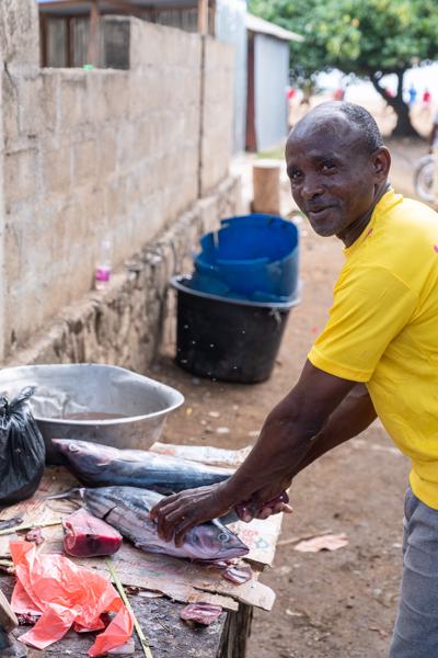 Fishmonger Preparing Tuna at a Roadside Market, Mohéli (Comoros) M'lédjélé, Comoros