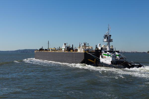 Tugboat NANTUCKET Pushing a Barge in New York Harbor New York, United States