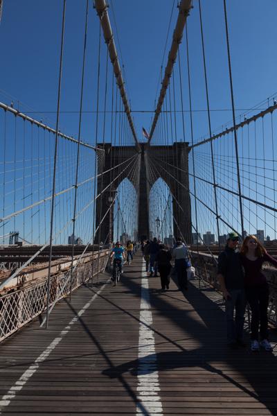 Pedestrians and Cyclists on the Brooklyn Bridge Walkway, New York City New York, United States