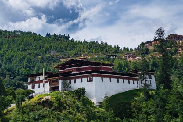 Bhutanese dzong on a forested hillside near Thimphu Thimphu, Bhutan