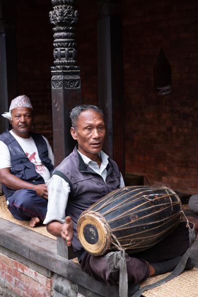 Musician with Barrel Drum in a Carved Nepalese Pavilion Bhaktapur, Nepal