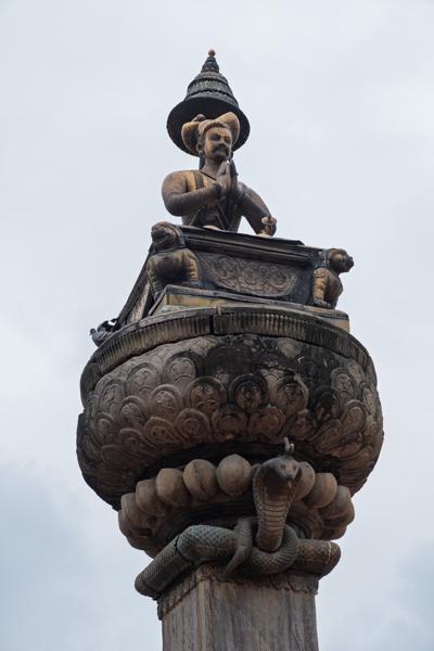 Prayerful Figure on a Carved Stone Column with Cobra Motif Bhaktapur, Nepal