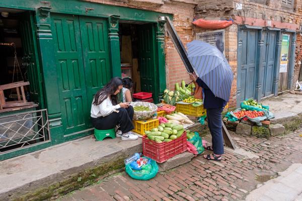 Street Market Scene with Fresh Produce Along a Brick Alley Bhaktapur, Nepal
