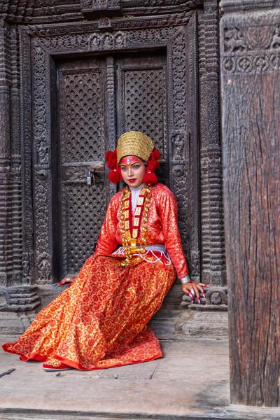 Regal Traditional Attire Beside Intricate Nepalese Doorway Bhaktapur, Nepal