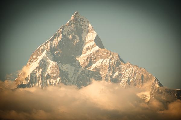 Sunlit Himalayan Peak Emerges from Clouds Pokhara, Nepal