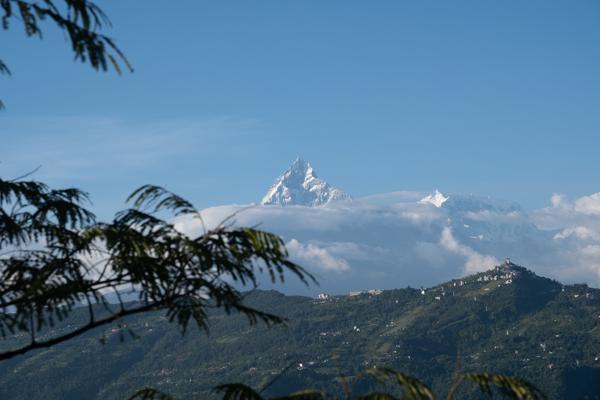 Snow-Capped Himalayan Peak Above Village Hills Pokhara, Nepal