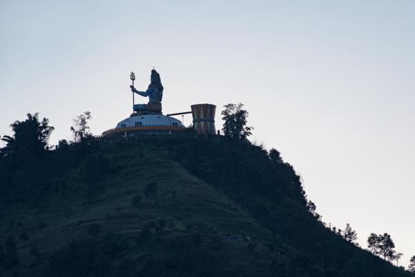 Hilltop Hindu Statue with Trident Silhouetted at Sunset Pokhara, Nepal