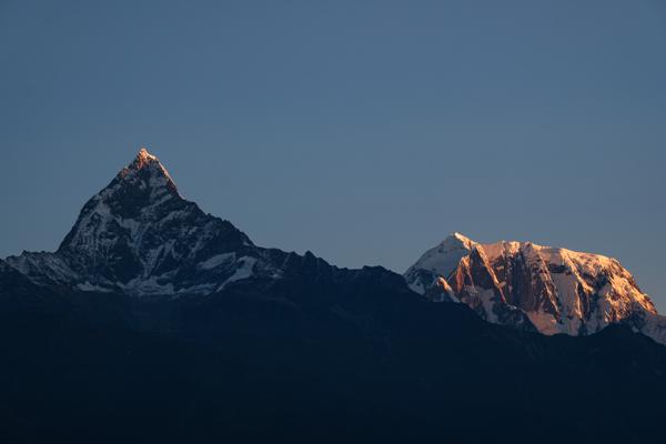 Sunlit peaks over the Nepalese Himalayas at sunset Pokhara, Nepal