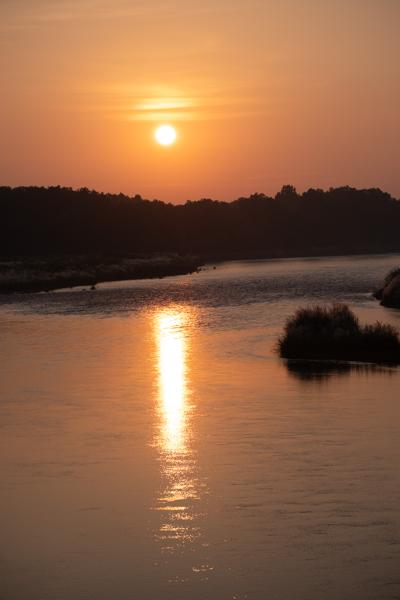 Sunset Over a Calm River with Silhouetted Banks Kasara, Nepal