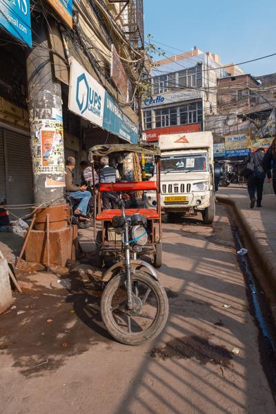 Cycle rickshaw on a sunlit Old Delhi street (Chandni Chowk area) Delhi, India