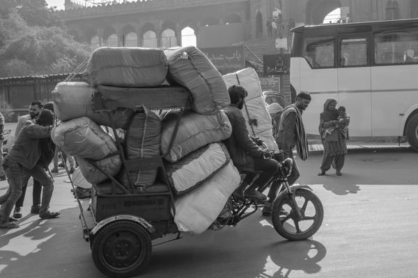 Overloaded cargo tricycle outside the Red Fort, Old Delhi Delhi, India