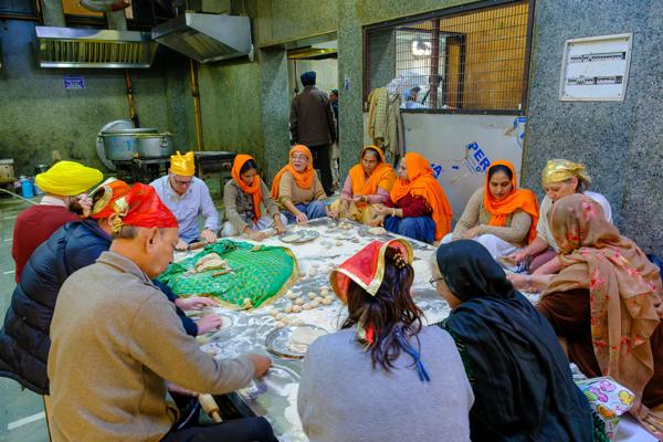 Volunteers Preparing Chapatis in a Gurdwara Langar Kitchen, Old Delhi Delhi, India