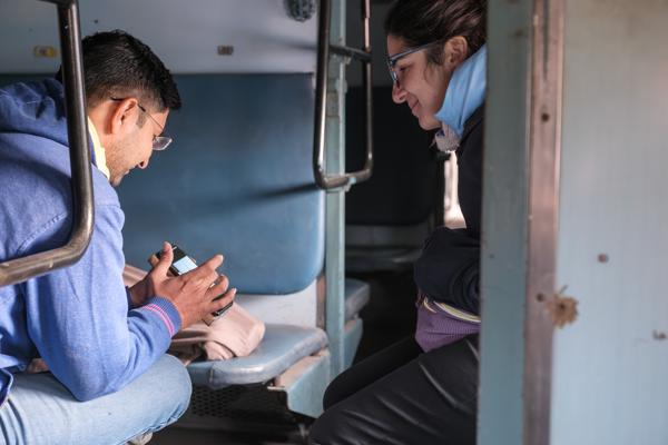 Sharing a moment in an Indian train compartment Kolayat, India