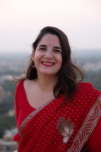 Smiling Woman in Red Sari at Jaisalmer Fort Overlook Jaisalmer, India