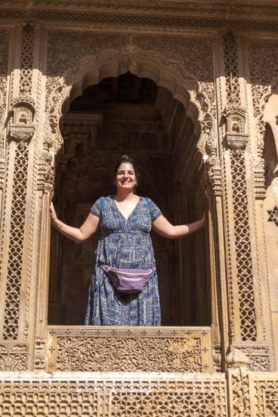 Traveler in an Ornate Sandstone Jharokha, Jaisalmer Jaisalmer, India