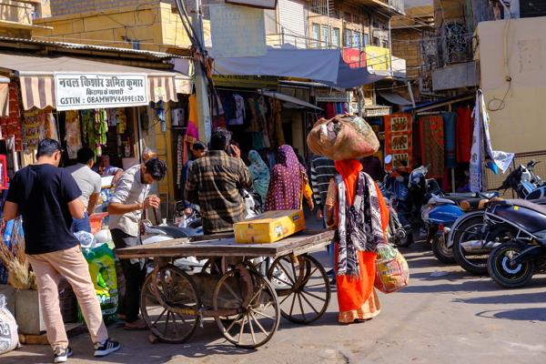 Morning bustle in a Jaisalmer bazaar street Jaisalmer, India
