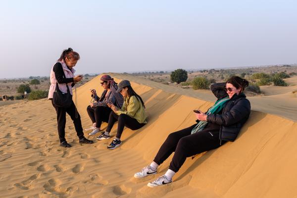 Friends Relaxing on a Sand Dune in the Thar Desert, India Damodara, India