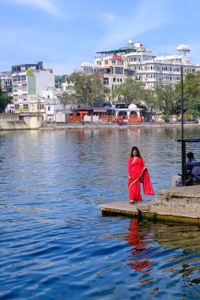 Woman in Red Sari by Lake Pichola, Udaipur Udaipur, India