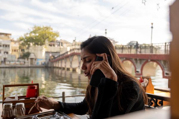 Phone Call at a Lakeside Café, Lake Pichola (Udaipur) Udaipur, India