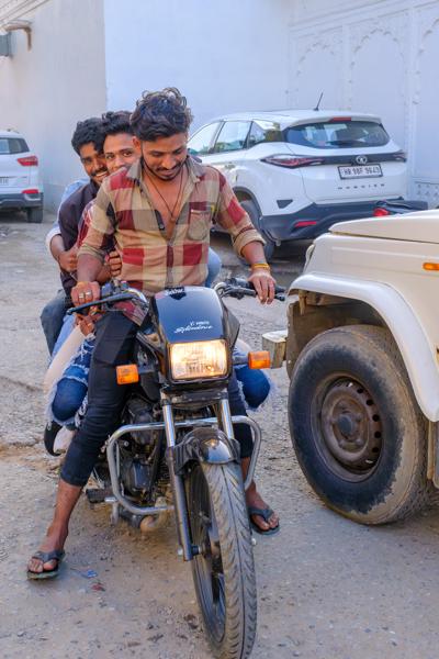 Friends on a Hero Splendor Motorcycle in a Rajasthan Lane Pushkar, India