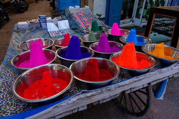 Vibrant powdered dyes for sale in a Pushkar market Pushkar, India