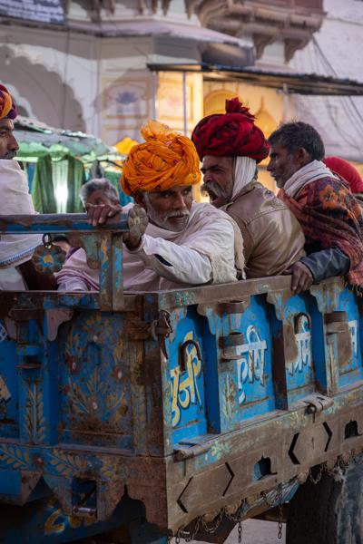 Rajasthani Men Riding in a Painted Truck Bed, Pushkar (Rajasthan) Pushkar, India