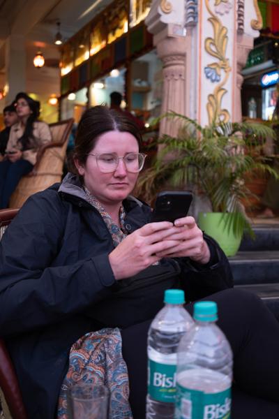 Woman Using a Smartphone at a Café in Rajasthan, India Pushkar, India