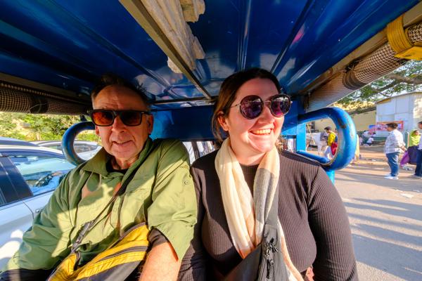 Passengers Riding in a Blue E‑Rickshaw in Jaipur Jaipur, India