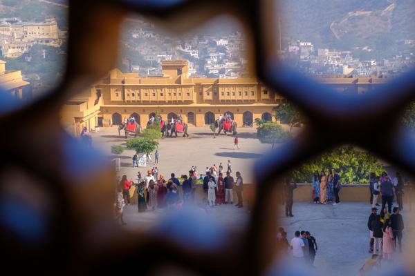 Amber Fort courtyard framed through a jali window, Jaipur Jaipur Municipal Corporation, India