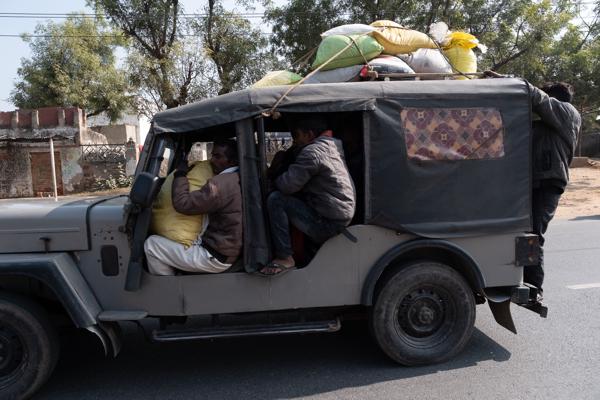 Overloaded Jeep Taxi on a Rural Road in Rajasthan, India Peechupara Khurd, India