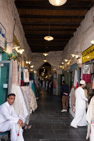 Narrow Middle Eastern Market Corridor with Dress Stalls Doha, Qatar