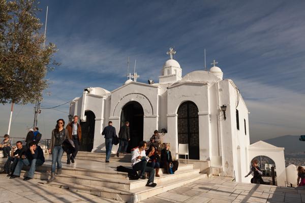 Athens Hilltop Chapel with Visitors Athens, Greece