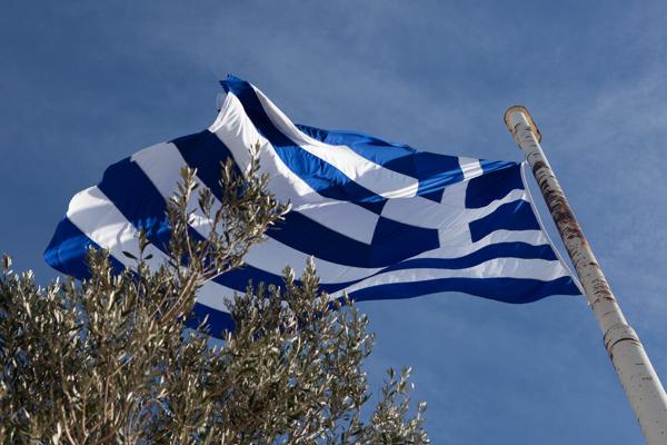 Greek Flag in Clear Athenian Sky Athens, Greece