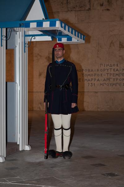 Greek Evzone Guard in ceremonial uniform at night Athens, Greece