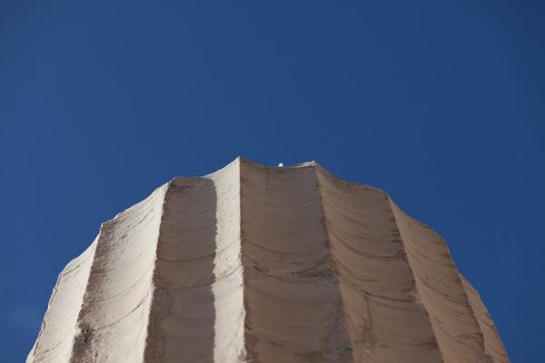 Close-up of a textured stone pinnacle against a blue sky Athens, Greece