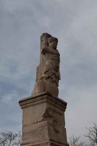 Ancient Merman Statue on a Pedestal in Athens Athens, Greece