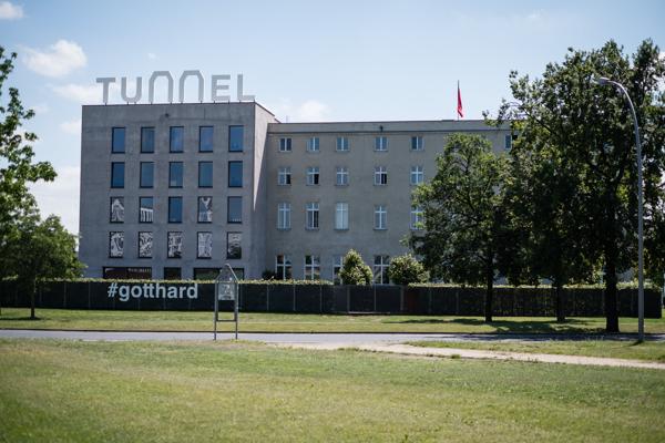 TUNNEL sign on a Berlin building with #gotthard on fence Berlin, Germany