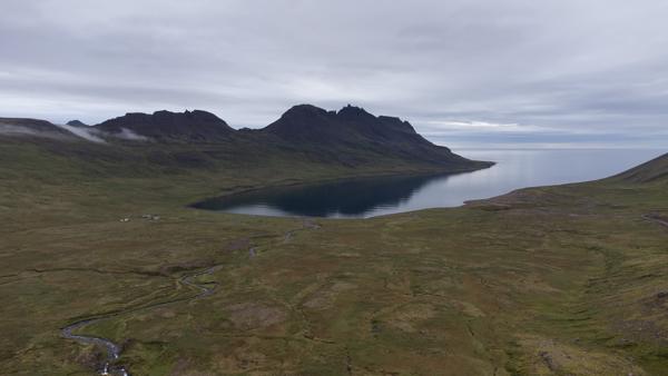 Icelandic Highlands with a Serene Lake under Moody Skies Iceland