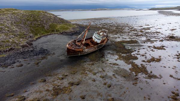 Rusting Shipwreck on a Rocky Icelandic Coast Dalabyggð, Iceland
