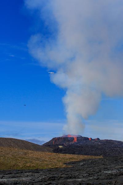 Volcanic Eruption with Lava and Passing Aircraft Iceland