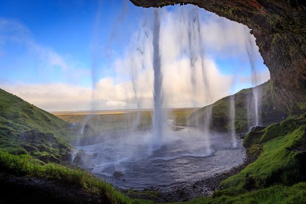 Seljalandsfoss Waterfall viewed from behind the falls Rangárþing eystra, Iceland