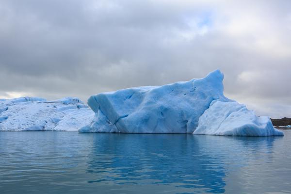 Blue Iceberg on a Calm Icelandic Glacial Lagoon Iceland