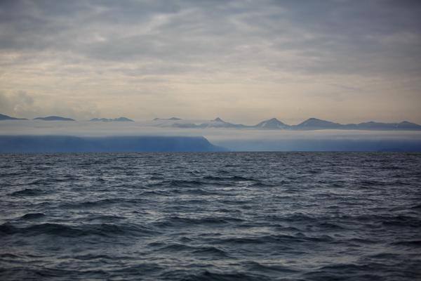 Mist Over the Icelandic Sea with Distant Mountain Range Iceland