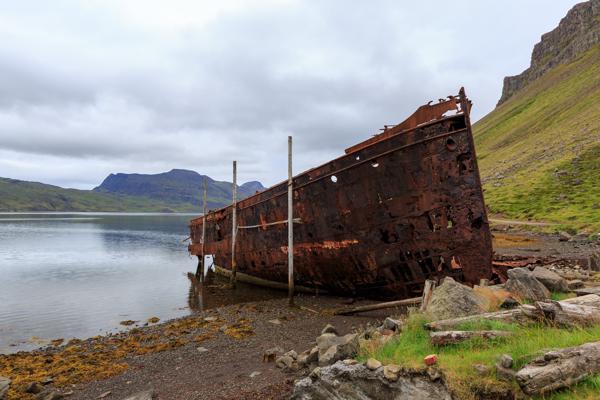 Rusting shipwreck on a Icelandic shore Iceland