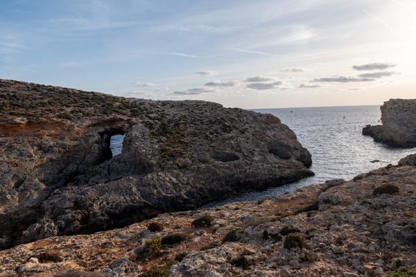 Rocky Mediterranean Coast with Natural Sea Arch Għajnsielem, Malta