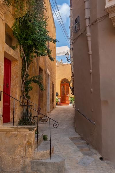 Sunlit narrow alley in Birgu, Malta Victoria, Malta
