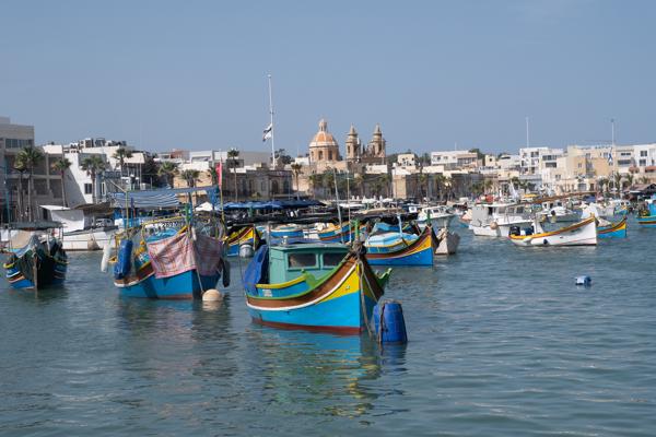 Colorful fishing boats in Marsaxlokk harbour, Malta Southern Region, Malta