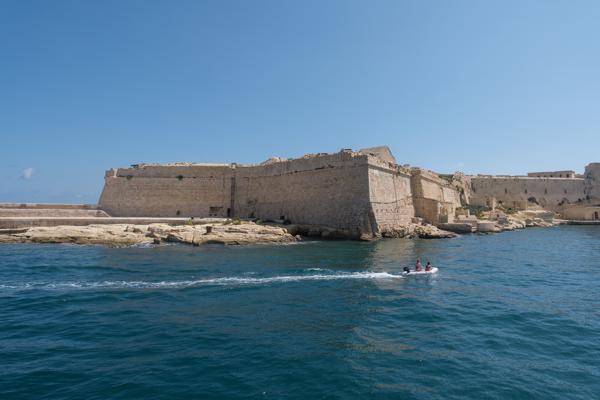 Dinghy Passing Historic Harbour Walls Port Region, Malta