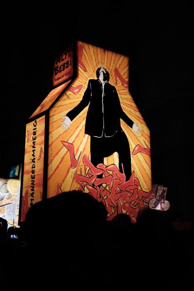 Illuminated Night Installation with Silhouetted Figure in Basel Fasnacht Basel, Switzerland