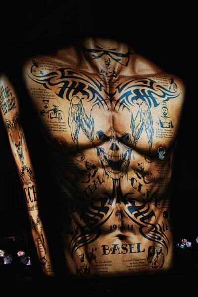 Basel Back-Tattoo Artwork in Dim Lighting Basel, Switzerland